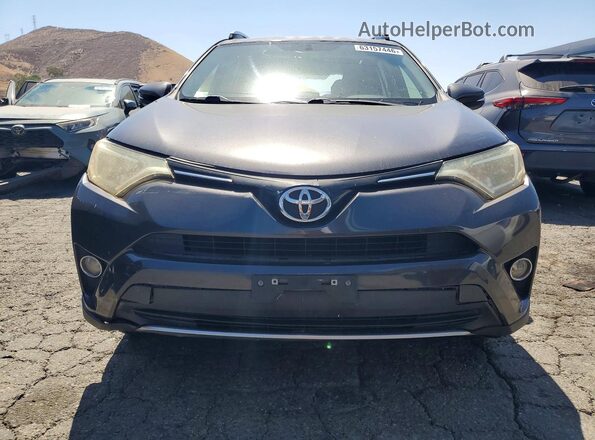 JTMWFREV7GJ075543 2016 TOYOTA RAV4 Gray Front view