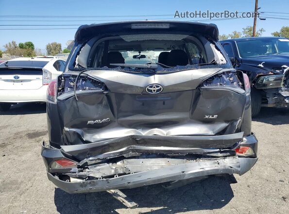 JTMWFREV7GJ075543 2016 TOYOTA RAV4 Gray Rear view