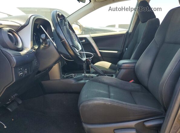 JTMWFREV7GJ075543 2016 TOYOTA RAV4 Gray Front interior view