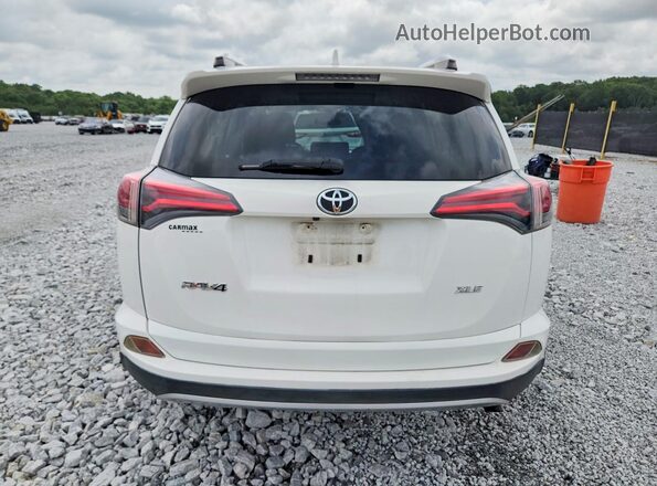 JTMWFREV7GJ076899 2016 TOYOTA RAV4 White Rear view
