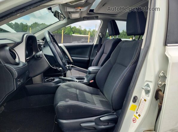 JTMWFREV7GJ076899 2016 TOYOTA RAV4 White Front interior view