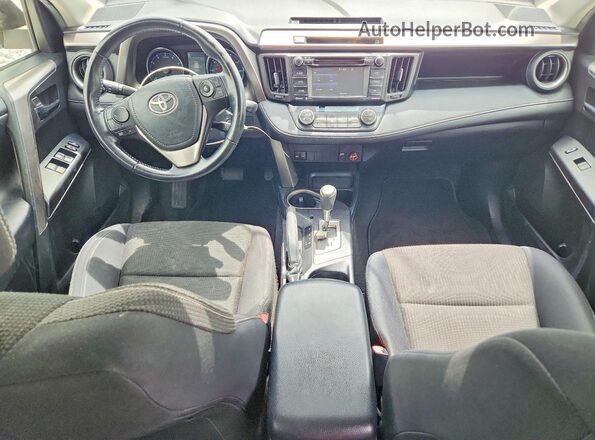 JTMWFREV7GJ076899 2016 TOYOTA RAV4 White Dashboard view