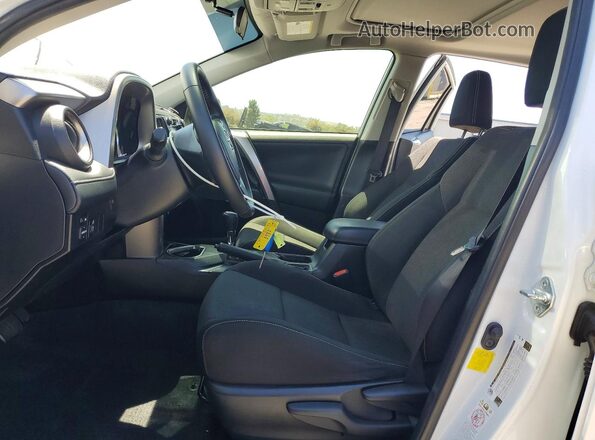 JTMWFREV7GJ084775 2016 TOYOTA RAV4 White Front interior view