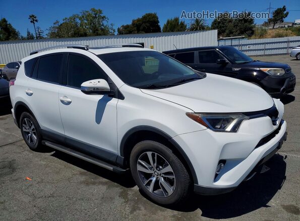 JTMWFREV7GJ084775 2016 TOYOTA RAV4 White Front right