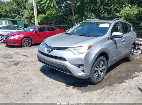 JTMWFREV7JJ186875 2018 TOYOTA RAV4 Silver Առջևի ձախ երեք քառորդ տեսարան