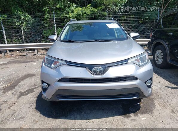 JTMWFREV7JJ186875 2018 TOYOTA RAV4 Silver Սարքավորումների վահանակի տեսք