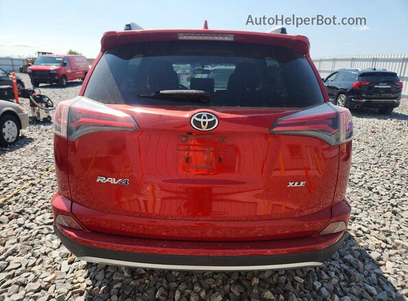 JTMWFREV8GJ061165 2016 TOYOTA RAV4 Red Rear view