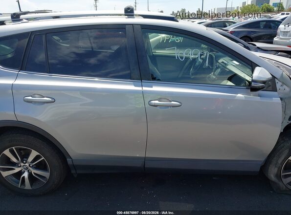 JTMWFREV8JD120642 2018 TOYOTA RAV4 Silver Вид задньої частини салону