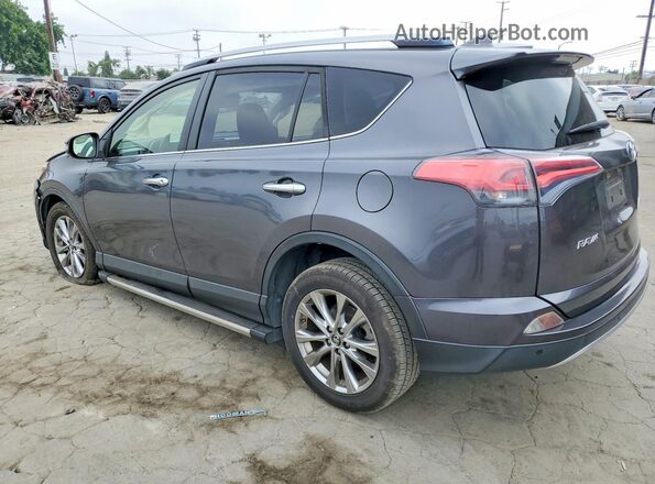 JTMYFREV8GJ062051 2016 TOYOTA RAV4 Gray Rear left