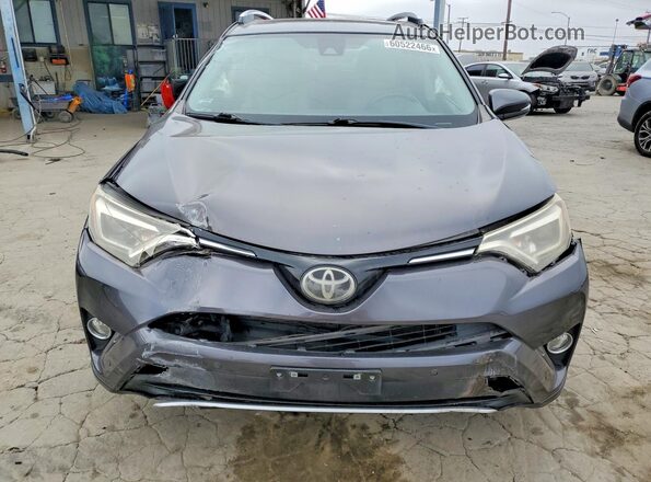 JTMYFREV8GJ062051 2016 TOYOTA RAV4 Gray Front view