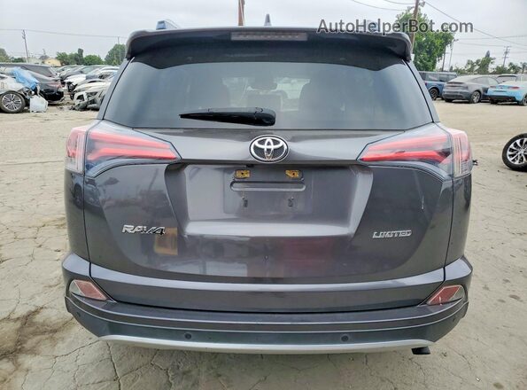 JTMYFREV8GJ062051 2016 TOYOTA RAV4 Gray Rear view