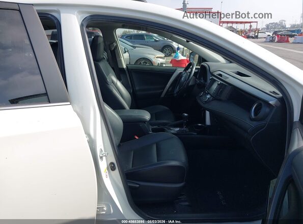 JTMYFREV9GJ077934 2016 TOYOTA RAV4 Белый Вид салона спереди
