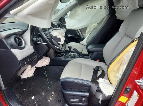 JTMYFREVXHJ132831 2017 TOYOTA RAV4 Red წინა სალონის ხედი