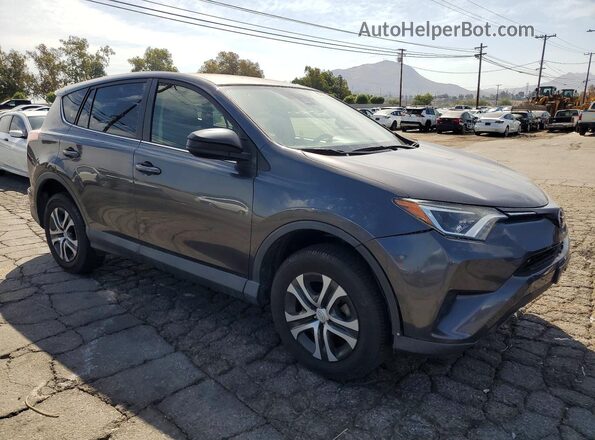 JTMZFREV0JJ742540 2018 TOYOTA RAV4 Gray Front right