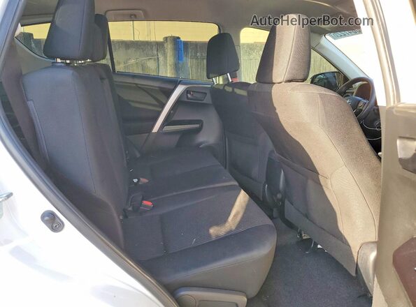 JTMZFREV1GD090972 2016 TOYOTA RAV4 White Rear seats view