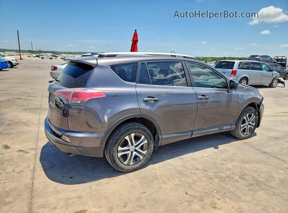 JTMZFREV1GJ077592 2016 TOYOTA RAV4 Gray Rear right