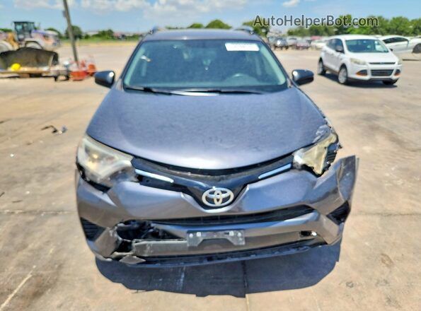 JTMZFREV1GJ077592 2016 TOYOTA RAV4 Gray Front view