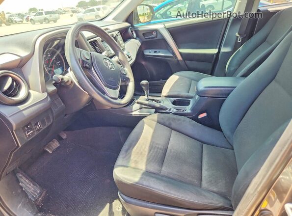 JTMZFREV1GJ077592 2016 TOYOTA RAV4 Gray Front interior view