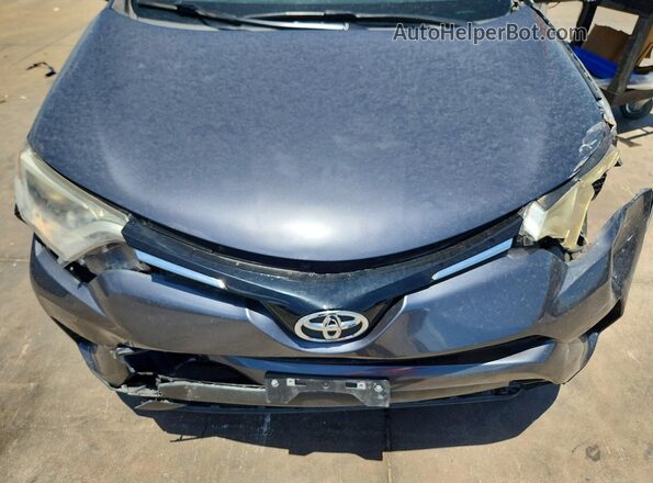 JTMZFREV1GJ077592 2016 TOYOTA RAV4 Gray Rear interior view