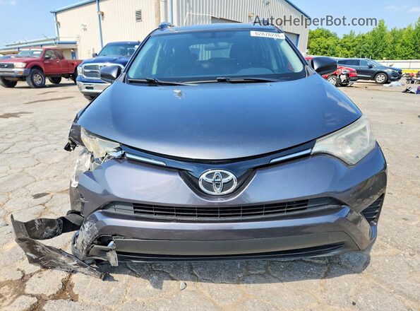 JTMZFREV1GJ081786 2016 TOYOTA RAV4 Gray Front view