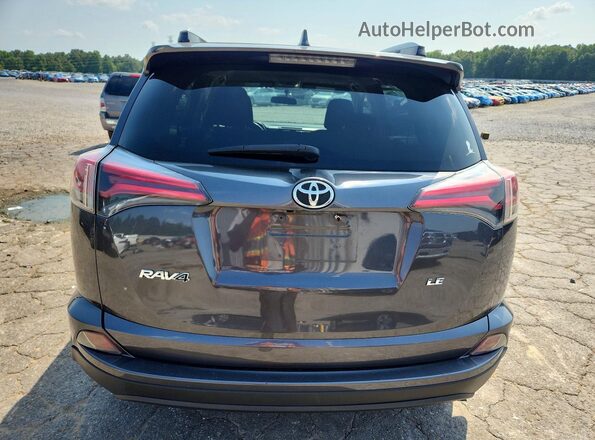 JTMZFREV1GJ081786 2016 TOYOTA RAV4 Gray Rear view