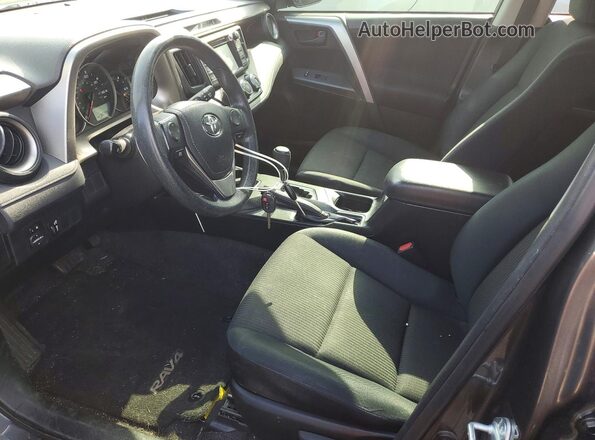 JTMZFREV1GJ081786 2016 TOYOTA RAV4 Gray Front interior view