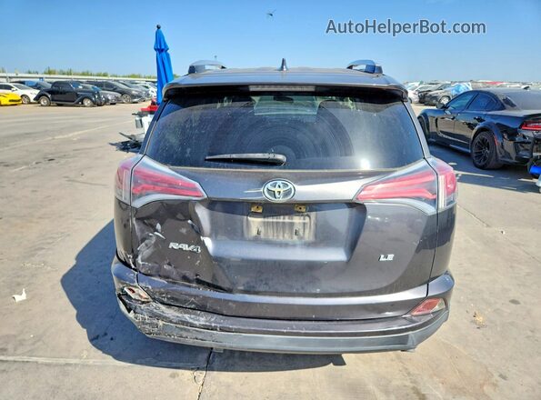JTMZFREV5GJ075831 2016 TOYOTA RAV4 Gray Rear view