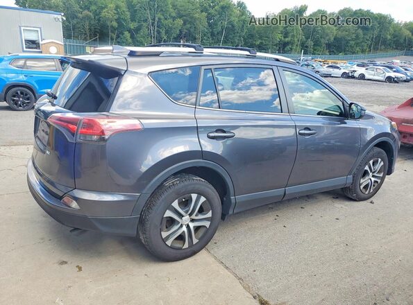 JTMZFREV5GJ088045 2016 TOYOTA RAV4 Gray Vista trasera