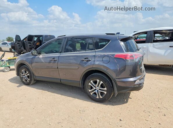 JTMZFREV5GJ096663 2016 TOYOTA RAV4 Gray Rear left