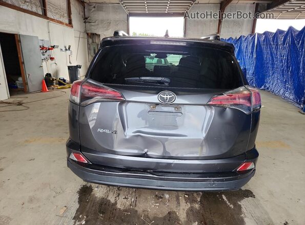 JTMZFREV5HJ104634 2017 TOYOTA RAV4 Gray Vista trasera