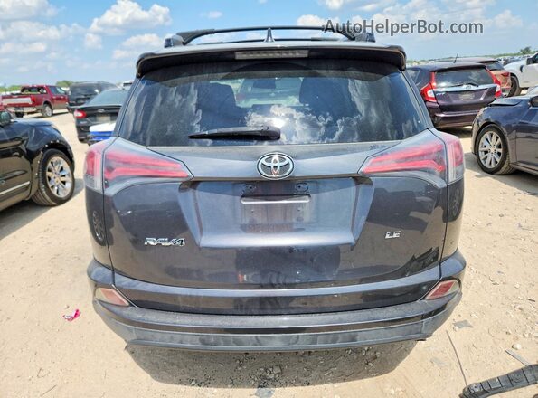 JTMZFREV8HJ108757 2017 TOYOTA RAV4 Gray Rear view
