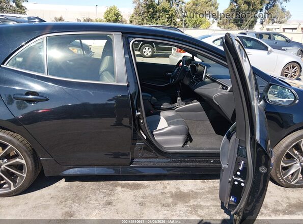 JTNK4RBE3K3030987 2019 TOYOTA COROLLA Черный Вид салона спереди
