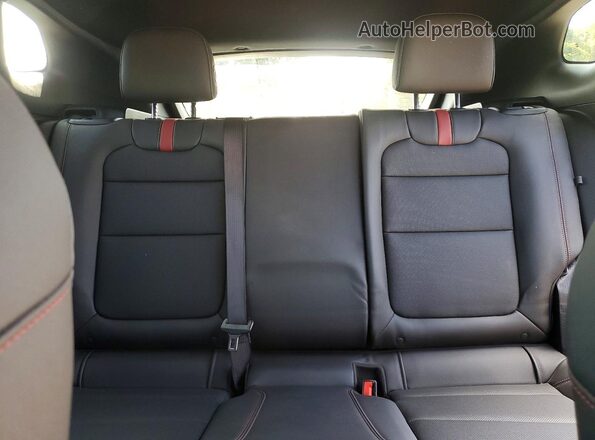KL77LJE29SC051937 2025 CHEVROLET TRAX Red Vista de los asientos traseros