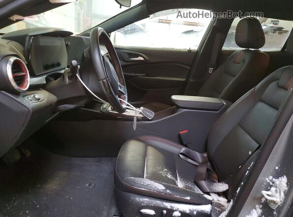KL77LJE29SC307610 2025 CHEVROLET TRAX Gray წინა სალონის ხედი
