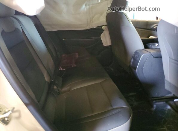 KL77LKEP5SC178797 2025 CHEVROLET TRAX White Vista de los asientos traseros