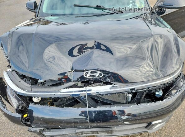 KM8HBCAB8RU084620 2024 HYUNDAI KONA Black Vista interior trasera