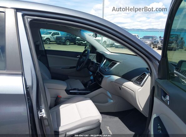 KM8J2CA40JU680957 2018 HYUNDAI TUCSON Gray Vista interior delantera