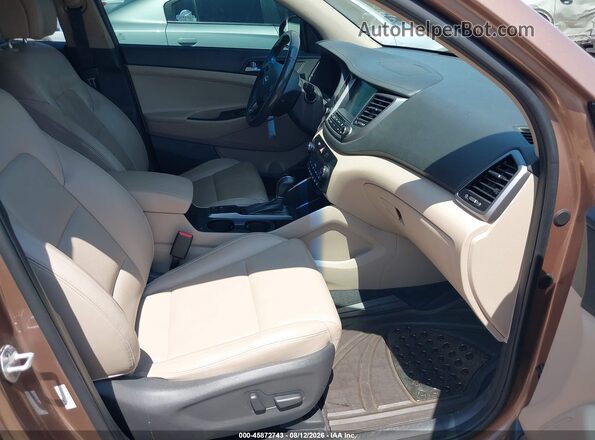 KM8J33A23GU220082 2016 HYUNDAI TUCSON Brown Front interior view