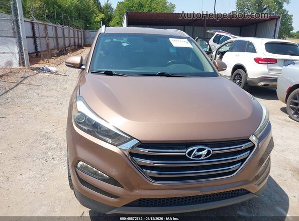 KM8J33A23GU220082 2016 HYUNDAI TUCSON Brown Instrument cluster view