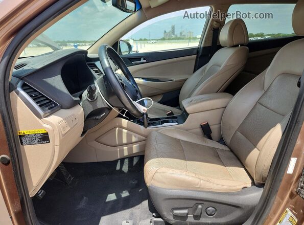 KM8J33A26GU071389 2016 HYUNDAI TUCSON Коричневый Вид салона спереди