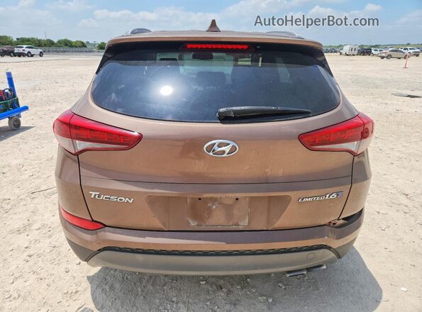 KM8J33A26GU071389 2016 HYUNDAI TUCSON Коричневый Вид сзади