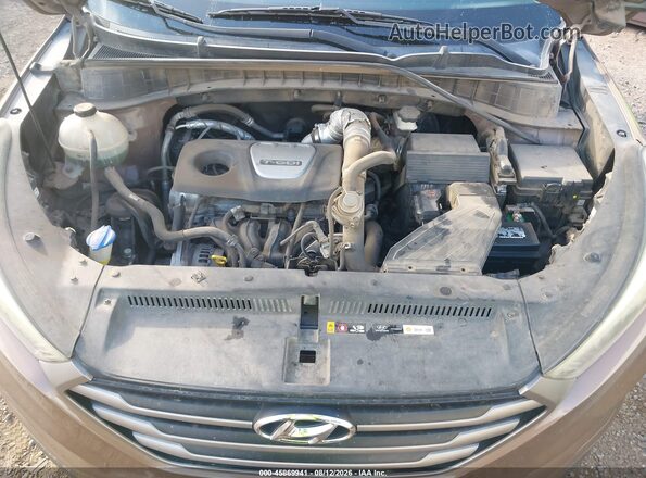 KM8J33A26GU189023 2016 HYUNDAI TUCSON Brown უკანა ხედი