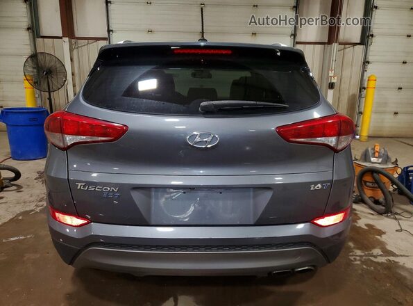 KM8J33A2XGU039271 2016 HYUNDAI TUCSON Gray Widok z tyłu