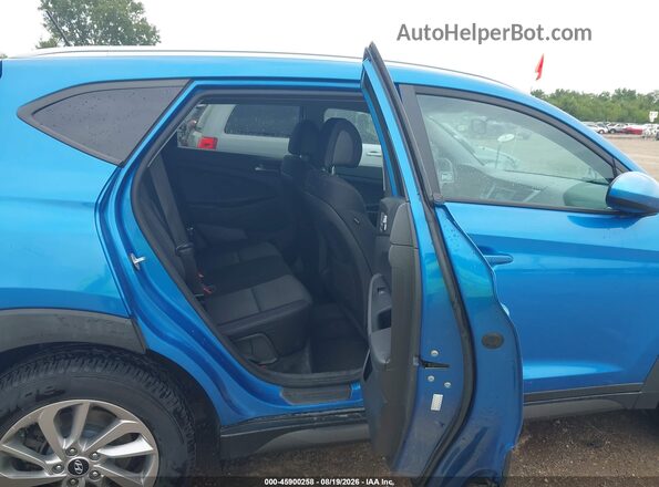 KM8J33A41GU128986 2016 HYUNDAI TUCSON Blue Vista de la etiqueta del VIN