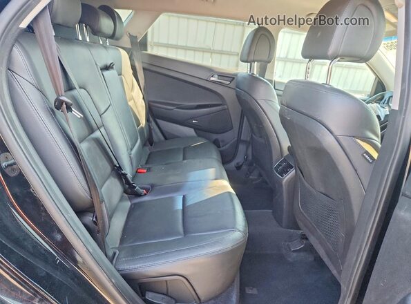 KM8J33A44HU381026 2017 HYUNDAI TUCSON Black Vista interior trasera