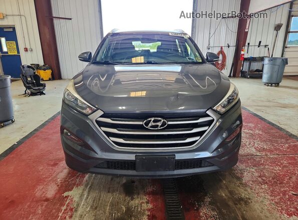KM8J33A44JU800563 2018 HYUNDAI TUCSON Gray Front view