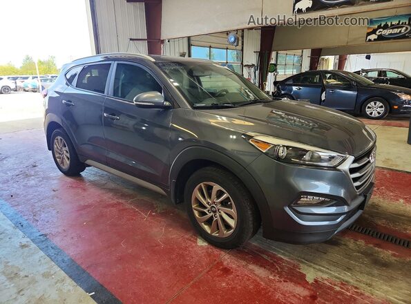 KM8J33A44JU800563 2018 HYUNDAI TUCSON Gray Front right