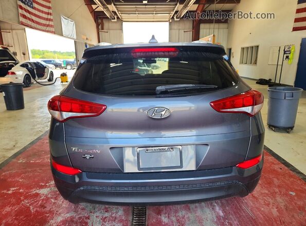 KM8J33A44JU800563 2018 HYUNDAI TUCSON Gray Rear view