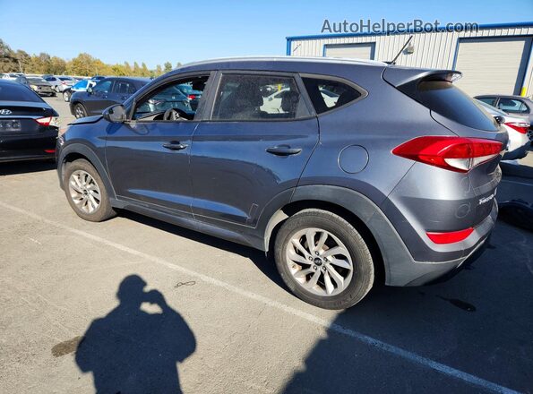KM8J33A45GU071563 2016 HYUNDAI TUCSON Gray Trasero izquierdo