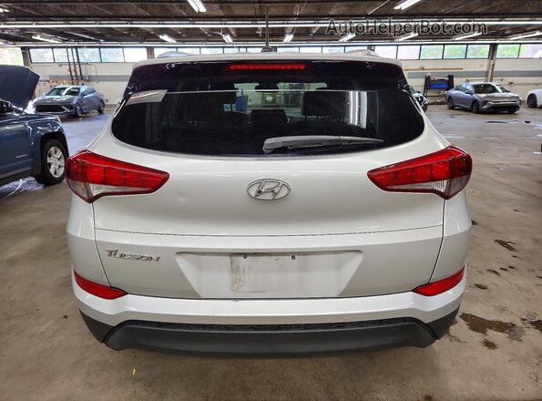 KM8J33A45GU090985 2016 HYUNDAI TUCSON Серебряный Вид сзади